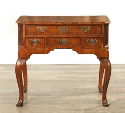 Lot 1365 - A GEORGE I FIGURED WALNUT LOWBOY