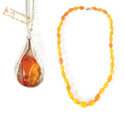 Lot 249 - AN AMBER NECKLACE WITH 9CT GOLD CLASP AND A SILVER AND AMBER NECKLACE