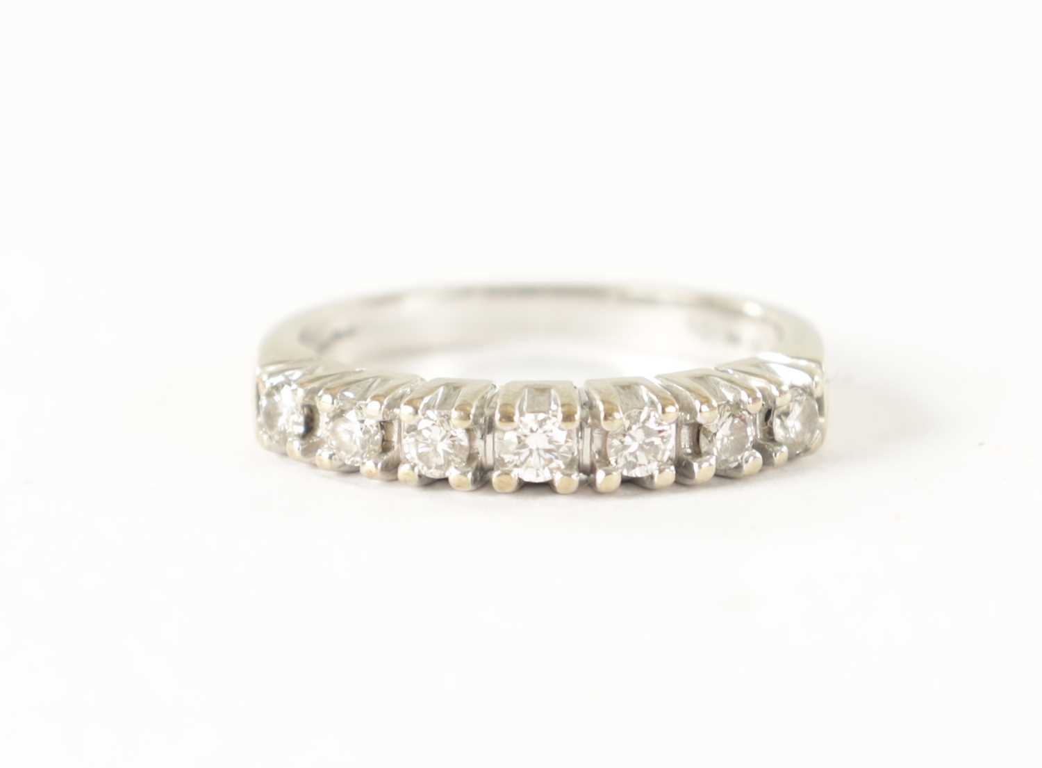 Lot 233 - A 9CT GOLD SEVEN STONE DIAMOND ETERNITY RING