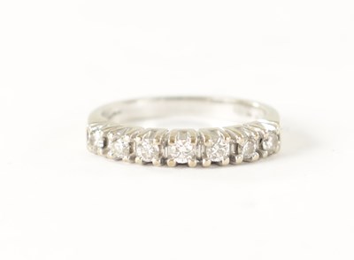 Lot 233 - A 9CT GOLD SEVEN STONE DIAMOND ETERNITY RING