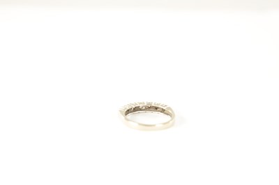 Lot 233 - A 9CT GOLD SEVEN STONE DIAMOND ETERNITY RING