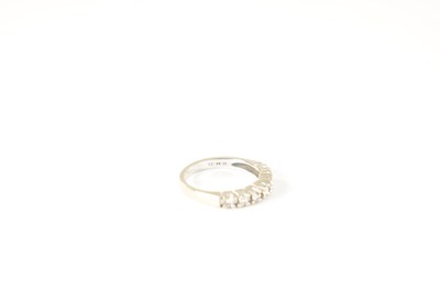 Lot 233 - A 9CT GOLD SEVEN STONE DIAMOND ETERNITY RING