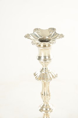 Lot 383 - A PAIR OF GEORGE II CAST SILVER PETAL BASE CANDLESTICKS