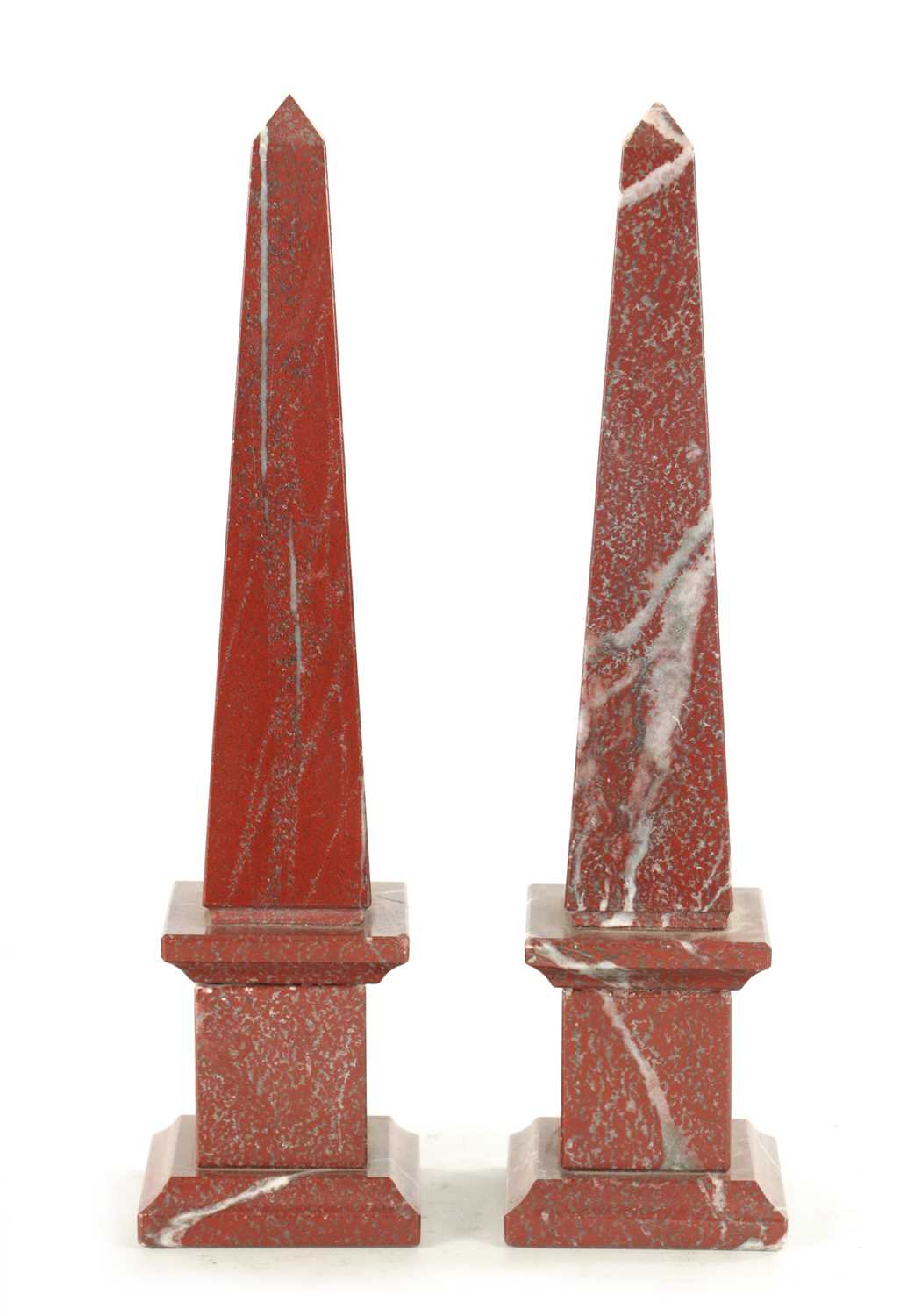 Lot 655 - A PAIR OF VEINED ROUGE MARBLE OBELISKS