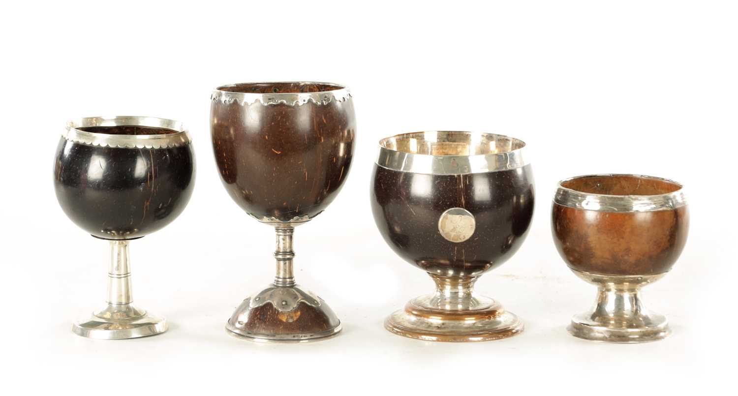 Lot 693 - A COLLECTION OF FOUR LATE GEORGIAN COCONUT GOBLETS