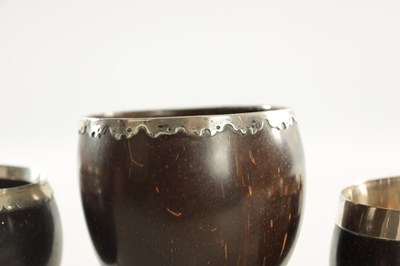 Lot 693 - A COLLECTION OF FOUR LATE GEORGIAN COCONUT GOBLETS