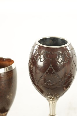 Lot 802 - TWO LATE GEORGIAN SILVER MOUNTED COCONUT GOBLETS