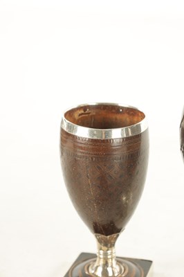 Lot 802 - TWO LATE GEORGIAN SILVER MOUNTED COCONUT GOBLETS