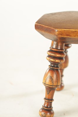 Lot 1205 - A 19TH CENTURY TREENWARE MINIATURE STOOL