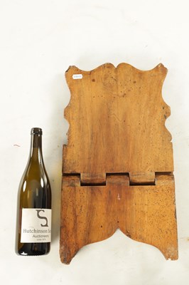 Lot 1180 - AN 18TH/19TH CENTURY CONTINENTAL WALNUT BOOKREST