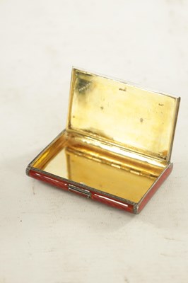 Lot 258 - AN ART DECO SILVER AND RED GUILLOCHE ENAMEL CIGARETTE CASE