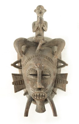 Lot 696 - A 19TH CENTURY AFRICAN CARVED WOOD TRIBAL MASK