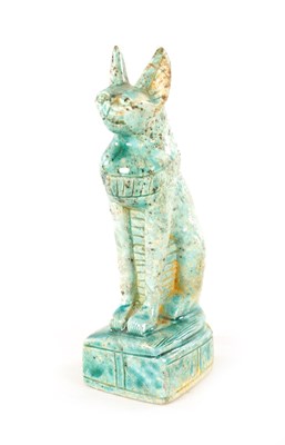 Lot 209 - AN EARLY EGYPTIANESQUE STONEWARE SCULPTURE OF A CAT