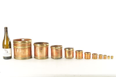 Lot 839 - A GRADUATED SET OF TEN INDIAN BRASS BOUND COPPER GRAIN MEASURES