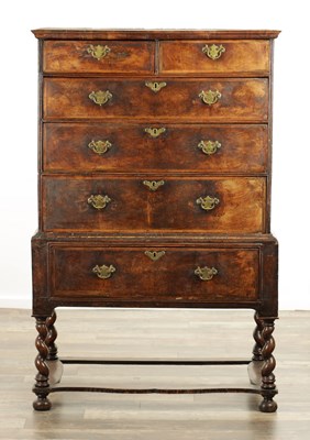 Lot 1318 - AN EARLY 18TH CENTURY FIGURED WALNUT CHEST ON STAND