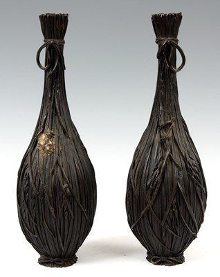 Lot 135 - AN UNUSUAL PAIR OF JAPANESE BRONZE BOTTLE...