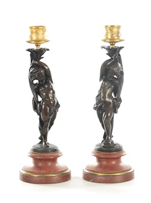 Lot 817 - A PAIR OF 19TH CENTURY BRONZE AND GILT BRONZE FIGURAL CANDLESTICKS