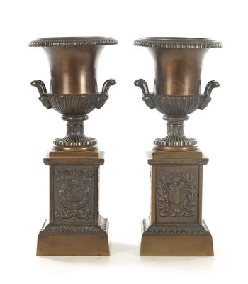 Lot 710 - A PAIR OF 19TH CENTURY BRONZE URNS ON STANDS