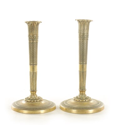 Lot 883 - A PAIR OF EARLY 19TH CENTURY FRENCH BRONZE CANDLESTICKS