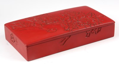 Lot 155 - A CHINESE RED LACQUER BOX with carved floral...