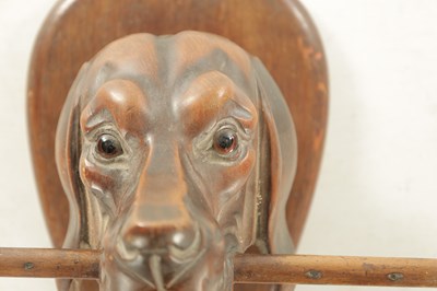 Lot 1197 - A LATE 19TH CENTURY CARVED FOX HOUND KEY RACK