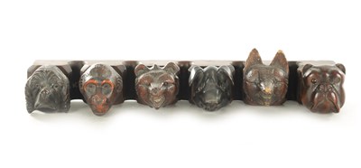 Lot 1172 - A 19TH CENTURY CARVED BLACK FOREST PIPE RACK