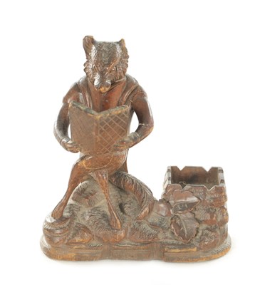 Lot 1158 - A LATE 19TH CENTURY CARVED BLACK FOREST DESK FOX TIDY