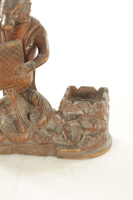 Lot 1158 - A LATE 19TH CENTURY CARVED BLACK FOREST DESK FOX TIDY