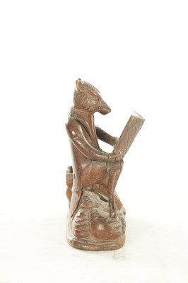 Lot 1158 - A LATE 19TH CENTURY CARVED BLACK FOREST DESK FOX TIDY