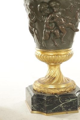 Lot 857 - FERDINAND BARBEDIENNE, A PAIR OF LATE 19TH CENTURY FRENCH BRONZE AND GILT BRONZE LIDDED URNS AFTER A DESIGN BY COLIDON