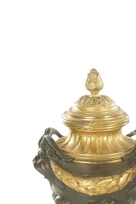 Lot 857 - FERDINAND BARBEDIENNE, A PAIR OF LATE 19TH CENTURY FRENCH BRONZE AND GILT BRONZE LIDDED URNS AFTER A DESIGN BY COLIDON