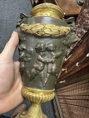 Lot 857 - FERDINAND BARBEDIENNE, A PAIR OF LATE 19TH CENTURY FRENCH BRONZE AND GILT BRONZE LIDDED URNS AFTER A DESIGN BY COLIDON