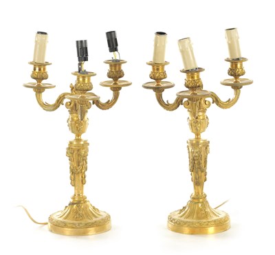 Lot 640 - A PAIR OF EARLY 20TH CENTURY ORMOLU FRENCH THREE BRANCH CANDELABRA