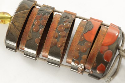 Lot 105 - A MEIJI PERIOD JAPANESE LACQUERED INRO WITH AMBER GLASS OJIME AND BONE NESUKE