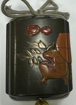 Lot 105 - A MEIJI PERIOD JAPANESE LACQUERED INRO WITH AMBER GLASS OJIME AND BONE NESUKE