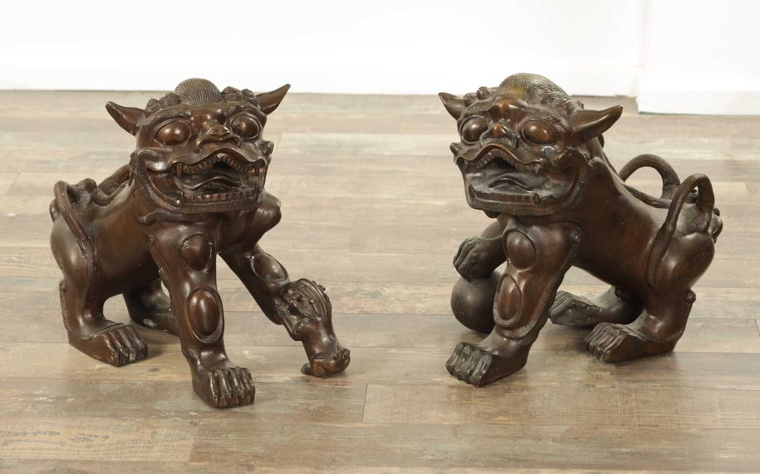 Lot 98 - A PAIR OF 19TH CENTURY CAST BRONZE FOO DOGS