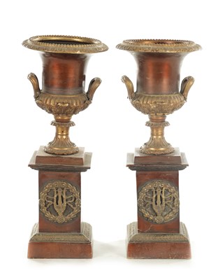 Lot 819 - A PAIR OF LATE 19TH CENTURY BRONZE AND GILT BRONZE URNS ON STANDS