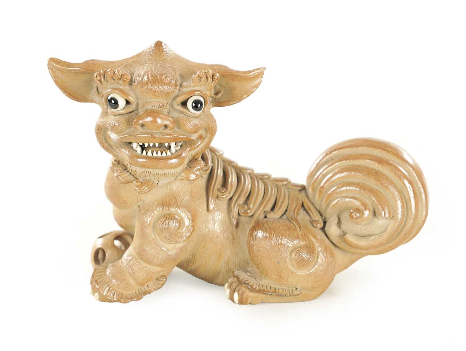 Lot 177 - A 19TH CENTURY CHINESE SALT GLAZE TERRACOTTA SEATED FOO DOG