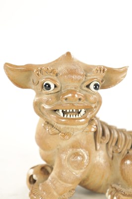 Lot 177 - A 19TH CENTURY CHINESE SALT GLAZE TERRACOTTA SEATED FOO DOG