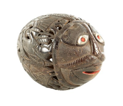 Lot 1148 - AN EARLY 19TH CENTURY EASTERN CARVED COCONUT BUGBEAR MONEYBOX