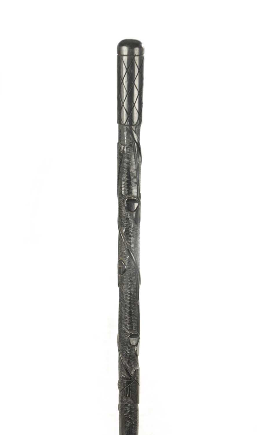 Lot 465 - A 19TH CENTURY IRISH BOG OAK WALKING CANE