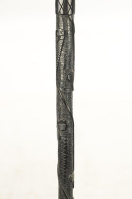 Lot 465 - A 19TH CENTURY IRISH BOG OAK WALKING CANE