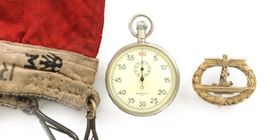 Lot 507 - A GERMAN THIRD REICH U-BOAT TORPEEDO TIMER STOPWATCH TOGETHER WITH NAVAL SUBMARINE BADGE AND NAZI NATIONAL NAVAL WAR FLAG.