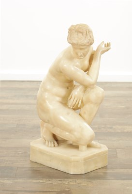 Lot 729 - A 19TH CENTURY NUDE ALABASTER SCULPTURE OF THE CROUCHING VENUS