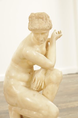 Lot 729 - A 19TH CENTURY NUDE ALABASTER SCULPTURE OF THE CROUCHING VENUS