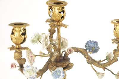 Lot 704 - A PAIR OF EARLY 19TH CENTURY FRENCH ORMOLU AND PORCELAIN MOUNTED CANDELABRA