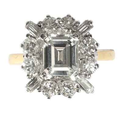 Lot 255 - A 1.82ct EMERALD CUT DIAMOND RING set with 1ct...