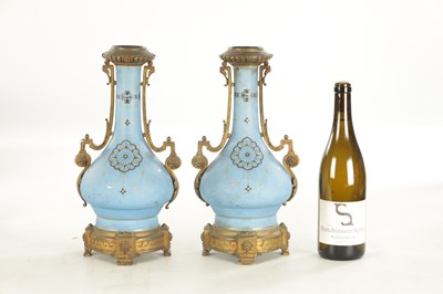 Lot 663 - A PAIR OF FRENCH LATE 19TH CENTURY CERAMIC AND GILT BRASS OIL LAMP BASES
