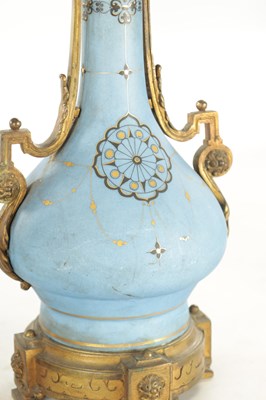 Lot 663 - A PAIR OF FRENCH LATE 19TH CENTURY CERAMIC AND GILT BRASS OIL LAMP BASES