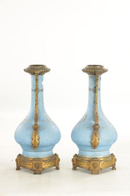 Lot 663 - A PAIR OF FRENCH LATE 19TH CENTURY CERAMIC AND GILT BRASS OIL LAMP BASES